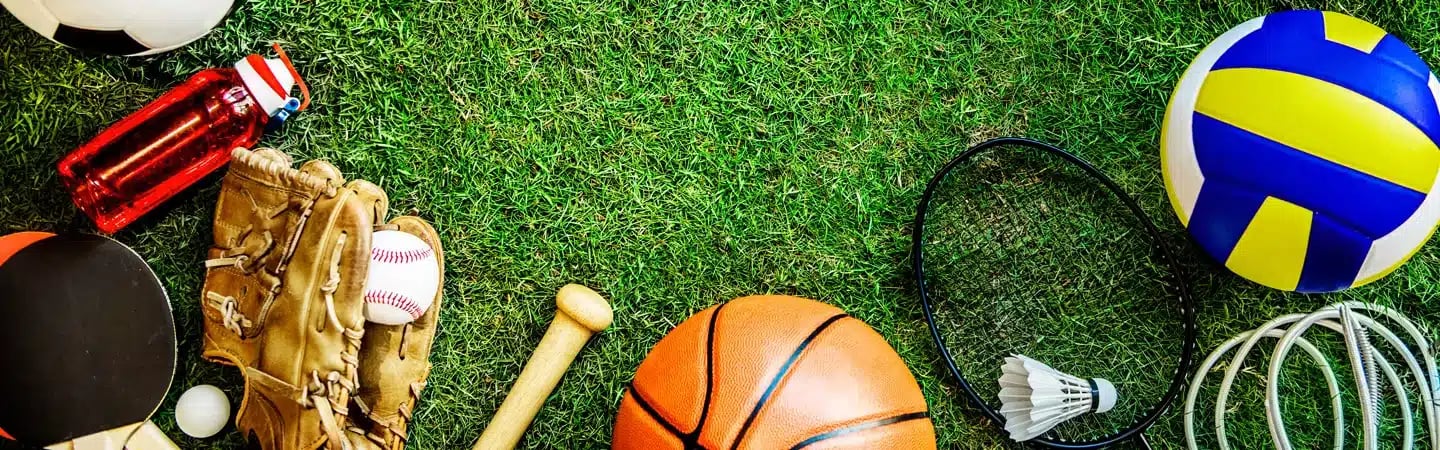 Various sports equipment, including a soccer ball, baseball glove, basketball, volleyball, shuttlecock, and ping pong paddle.