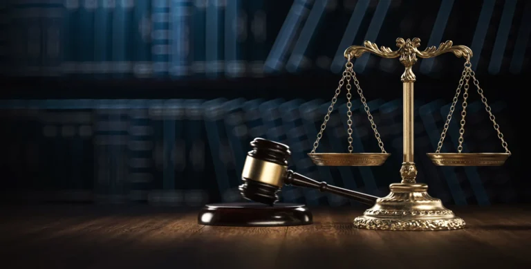 The scales of justice and gavel on a desk