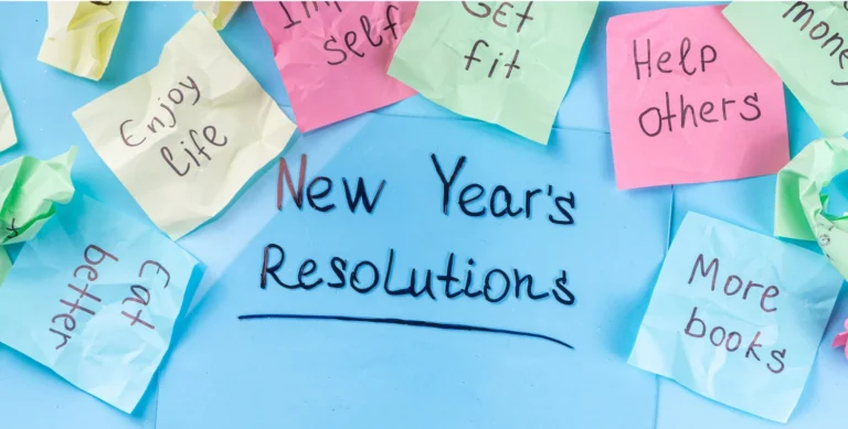 Handwritten "New Year's Resolutions" surrounded by colorful sticky notes with goals like "Get fit," "Eat better," and "Help others.