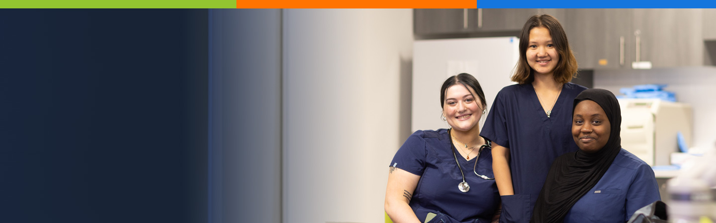 Three medical professionals in scrubs smile at the camera in a healthcare setting with a colorful header above them.