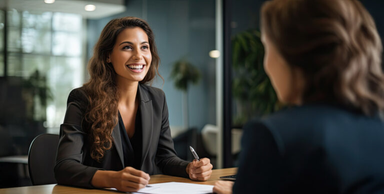 A confident businesswoman smiling during a professional meeting.